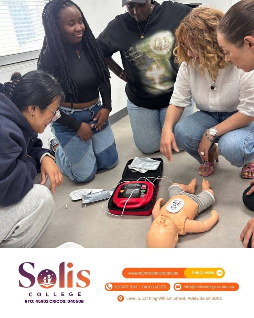 Students practising CPR on infant manikins